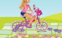 Barbie anda de bicicleta